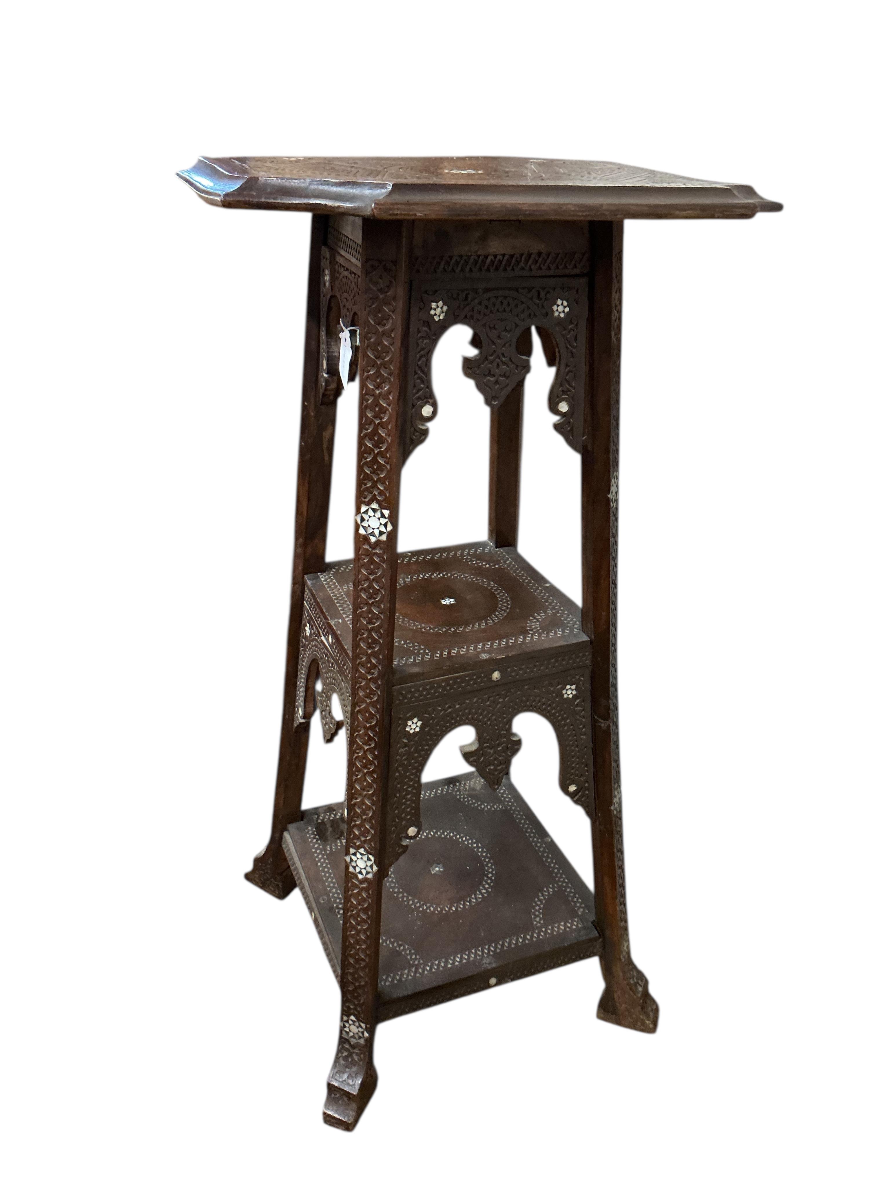 A Damascan mother of pearl inlaid carved hardwood three tier plant stand, width 48cm, height 102cm
